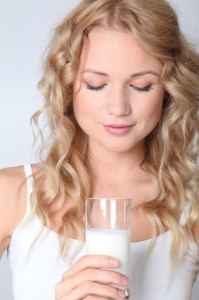 woman drinking almond milk